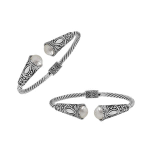 Sterling silver twisted bangle with pearl ends and oxidized Balinese design