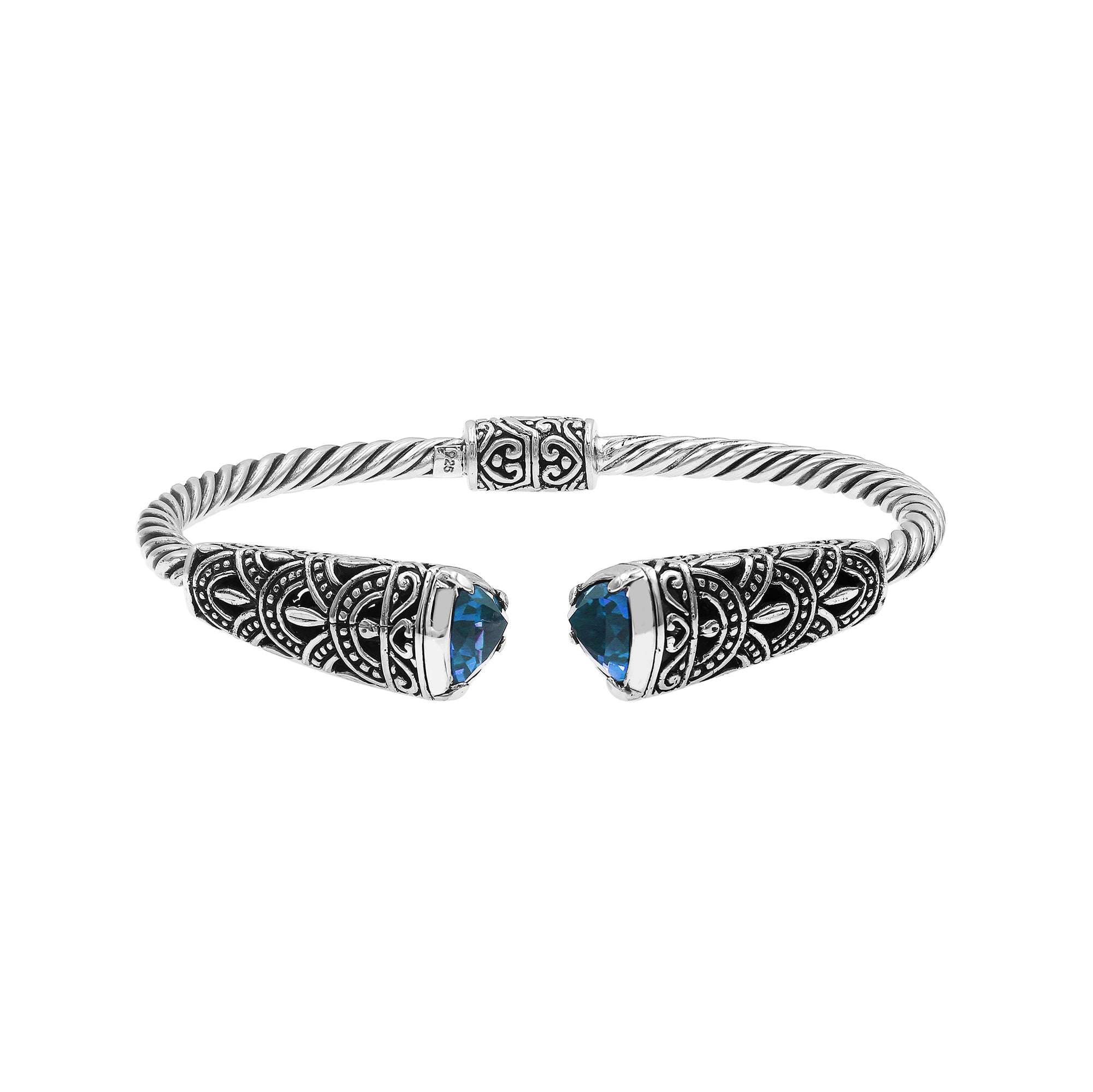 Sterling silver twisted bangle with blue topaz quartz ends and oxidized Balinese design