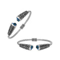 Sterling silver twisted bangle with blue topaz quartz ends and oxidized Balinese design