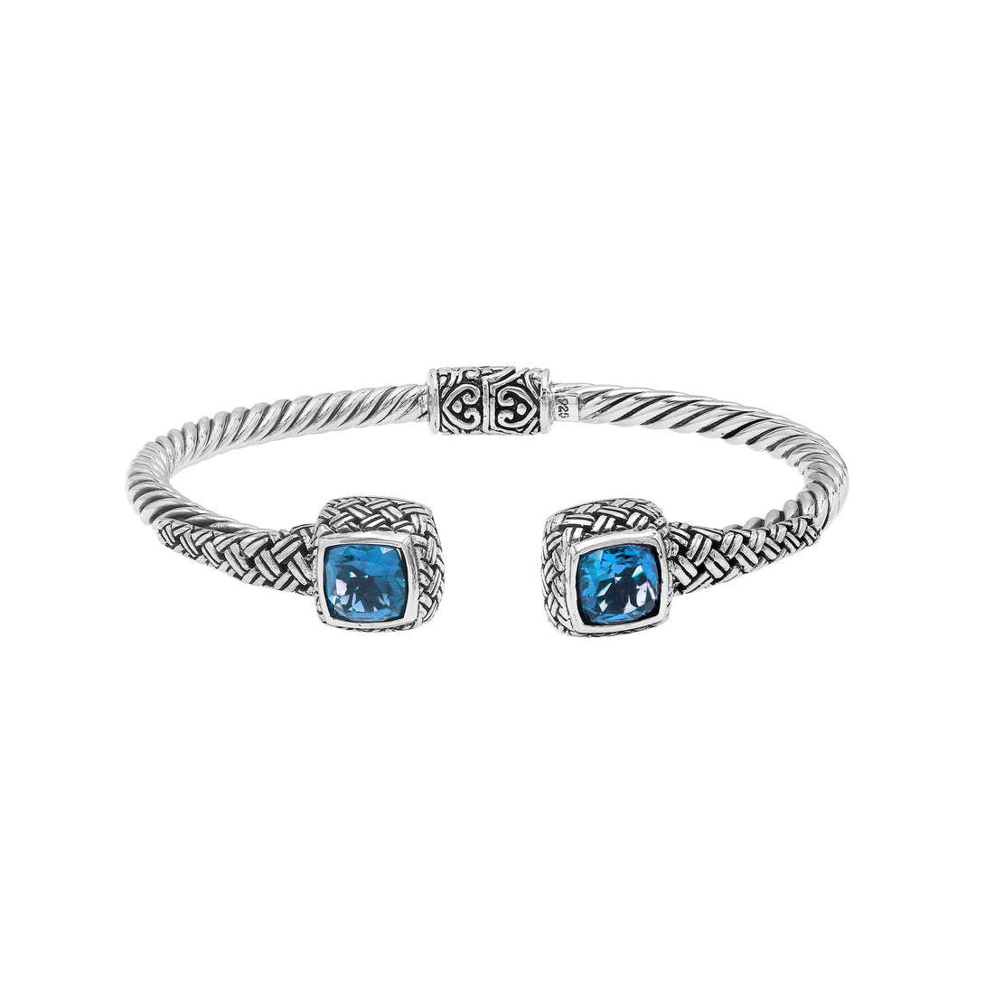 Sterling silver braided bangle with blue topaz quartz ends and Balinese oxidized design