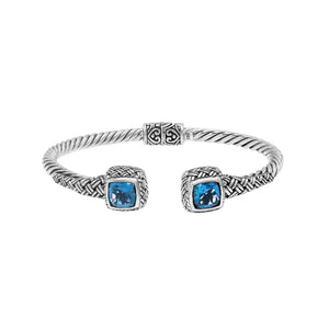 Sterling silver braided bangle with blue topaz quartz ends and Balinese oxidized design
