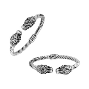 Sterling silver twisted bangle with dragon face design and oxidized Balinese pattern