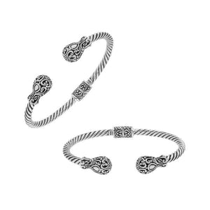 Sterling silver twisted bangle with ornate Balinese end design and oxidized finish