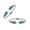 Sterling silver twisted bangle with blue topaz quartz ends and Balinese oxidized detailing