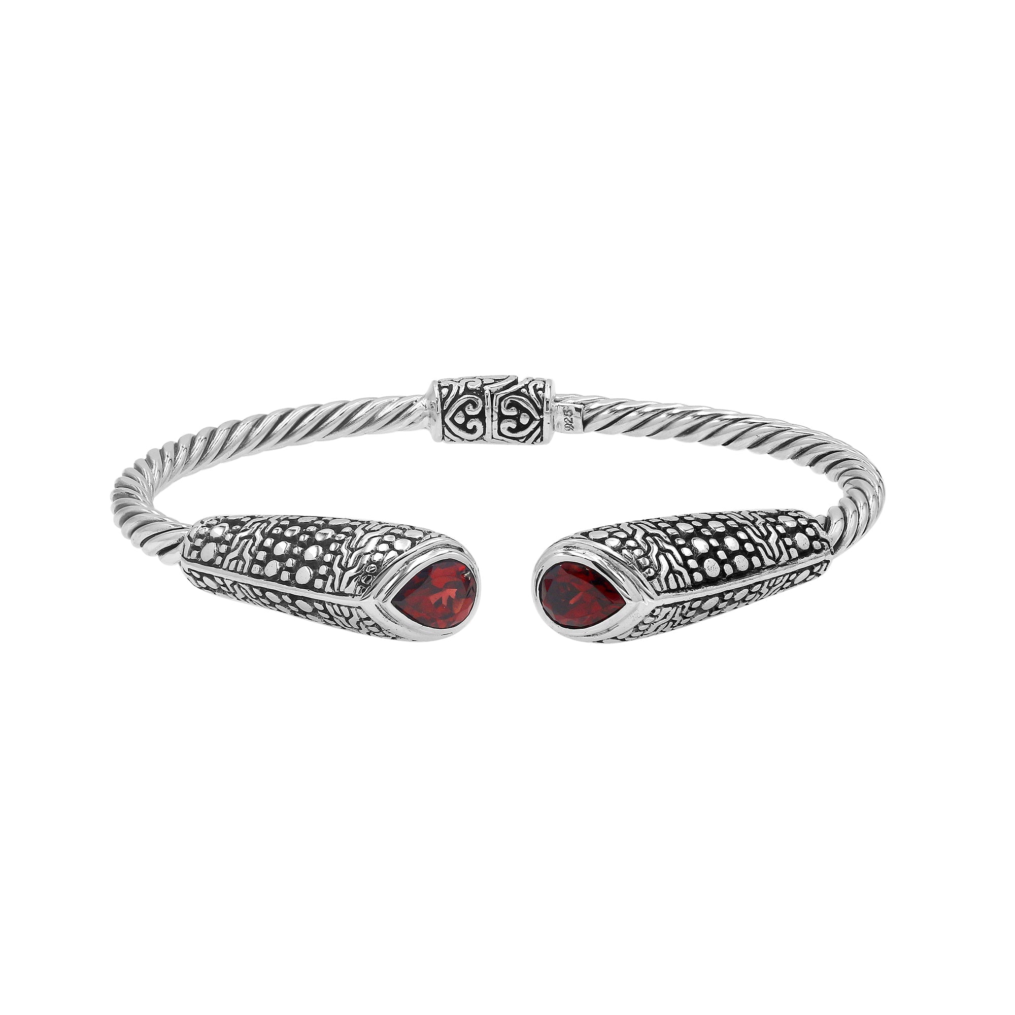 Sterling silver twisted bangle with garnet quartz ends and Balinese oxidized dot pattern