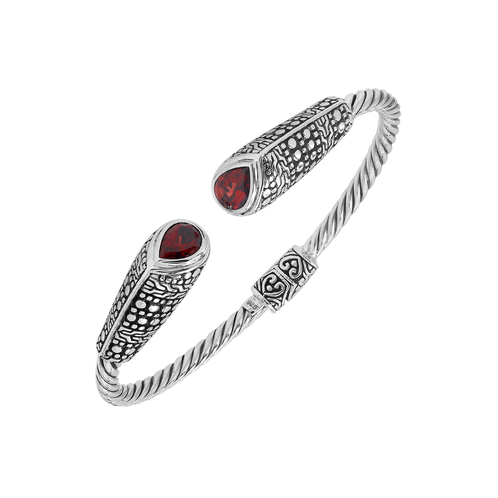 Sterling silver twisted bangle with garnet quartz ends and Balinese oxidized dot pattern
