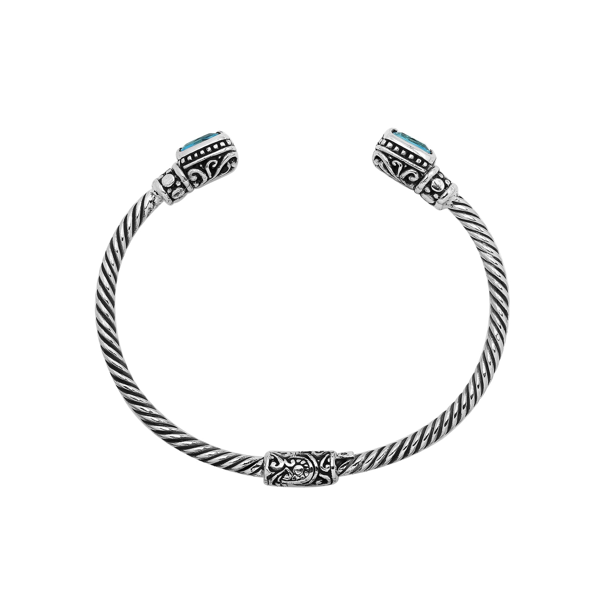 Silver twisted cable bangle in 925 sterling silver with Blue Topaz Quartz and ornate Balinese engraving.