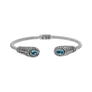 Silver twisted cable bangle in 925 sterling silver with Blue Topaz Quartz ends and Balinese engraving.