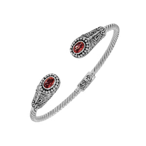 Silver twisted cable bangle in 925 sterling silver with Garnet Quartz ends and Balinese engraving.