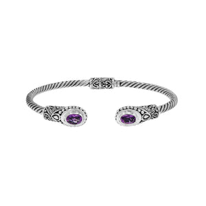Silver twisted cable bangle in 925 sterling silver with Amethyst Quartz ends and Balinese engraving.