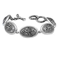 Sterling Silver oval link bracelet featuring detailed scroll pattern panels and a secure toggle lock, designed for wholesale buyers needing refined craftsmanship and durability.