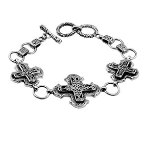 Sterling Silver bracelet featuring multiple cross-shaped links with detailed scroll patterns, polished edges, and a secure toggle lock for wholesale jewelry collections.
