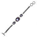 Wholesale sterling silver bracelet featuring three cushion Mystic Quartz stones with vibrant iridescent hues, detailed Balinese frames, woven chain accents, and a secure toggle lock closure.