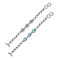 Wholesale sterling silver bracelet featuring three cushion Blue Topaz Quartz stones set in Balinese-style frames with textured silver chain links and a secure toggle lock.