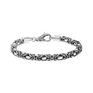 Wholesale sterling silver bracelet featuring a 6MM braided rope-pattern chain with oxidized highlights and an ornate lobster lock designed for strong, secure, handcrafted Balinese quality.