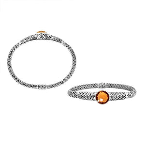 Wholesale sterling silver woven chain bracelet featuring a golden Citrine Quartz centerpiece, intricate Balinese leaf engravings, and a secure push clasp for premium gemstone assortments.