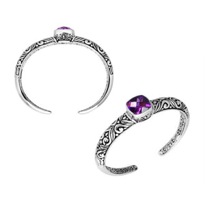 Wholesale sterling silver open bangle featuring a cushion-cut Amethyst Quartz centerpiece, detailed Balinese scroll engravings, and a secure hinge lock for premium artisan jewelry assortments.