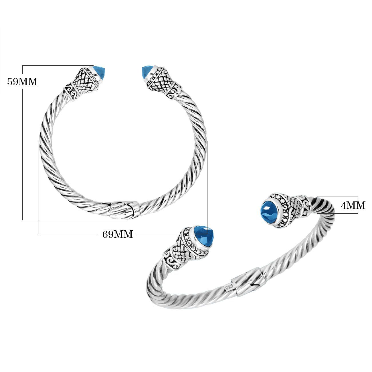 Wholesale sterling silver twisted cable cuff bracelet with faceted blue topaz quartz end caps, hinge lock, and ornate Balinese engravings for premium jewelry collections.