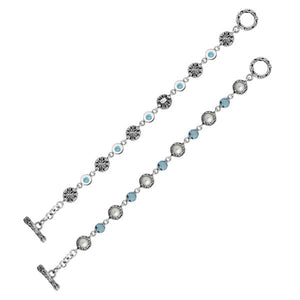 Wholesale sterling silver bracelet featuring alternating Mabe pearl and Blue Topaz quartz round links with oxidized detailing and a secure toggle lock design.