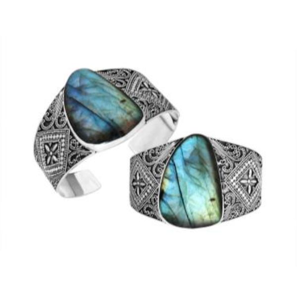 Wholesale sterling silver wide Bali engraved cuff bracelet showcasing a striking labradorite centerpiece with polished–oxidized detailing for premium bulk jewelry inventory requirements.
