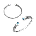 Wholesale sterling silver Bali engraved hinge cuff bracelet featuring bright blue topaz quartz accents with polished–oxidized artistry, crafted for premium wholesale jewelry inventory needs.