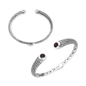 Wholesale sterling silver Bali engraved hinge cuff bracelet featuring deep red garnet quartz accents with polished–oxidized detailing, ideal for premium bulk jewelry inventory selections.