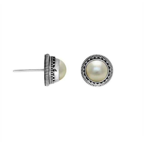 Sterling silver stud earrings with White Pearls and a dotted Balinese border.