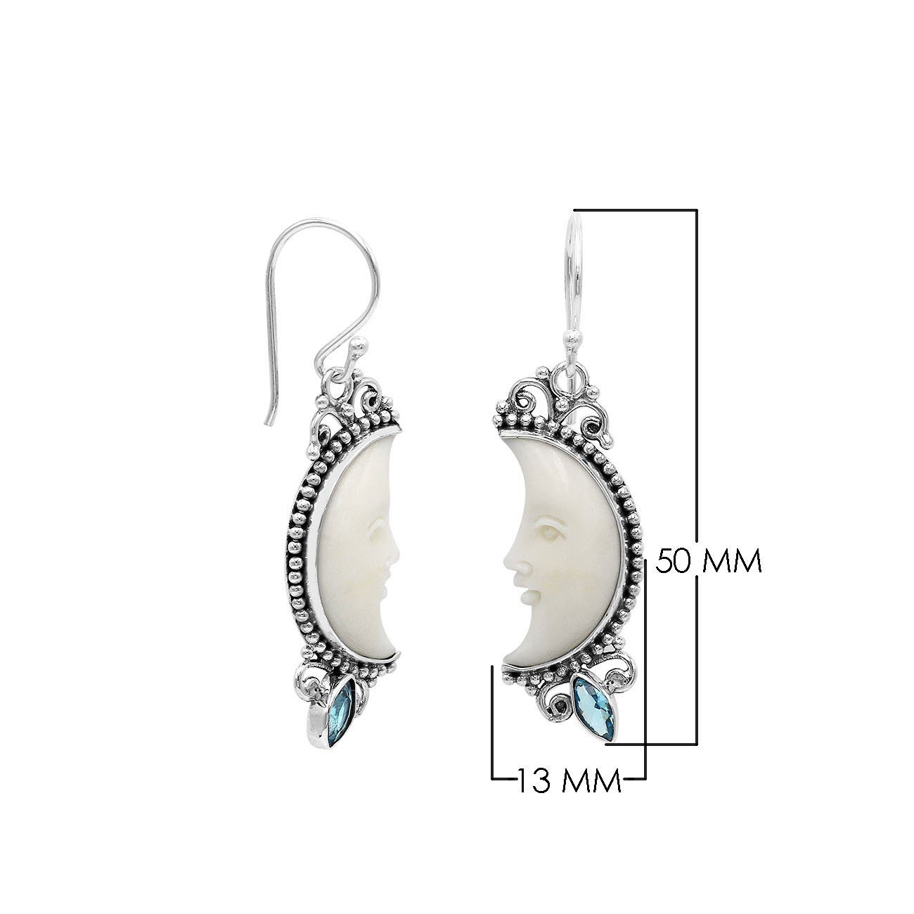 Sterling silver lunar bone face earrings with blue topaz quartz accent and earwire lock