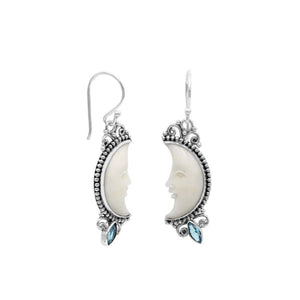 Sterling silver lunar bone face earrings with blue topaz quartz accent and earwire lock