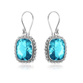 Silver earrings with faceted rectangular Blue Topaz Quartz and beaded edging
