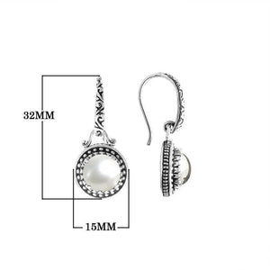 Wholesale sterling silver earrings with round Mabe Pearl and handcrafted metal detailing.