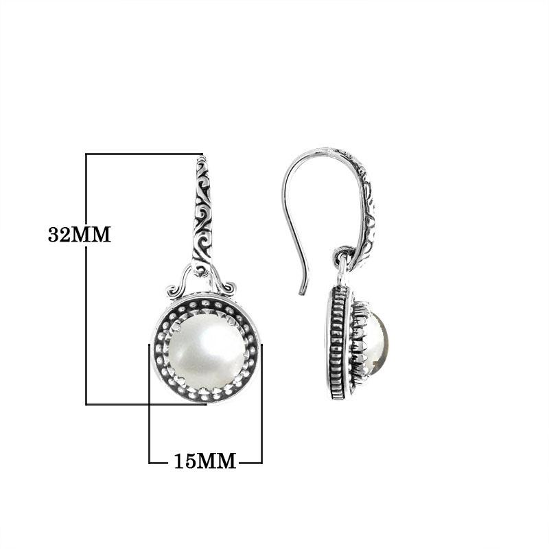 Wholesale sterling silver earrings with round Mabe Pearl and handcrafted metal detailing.