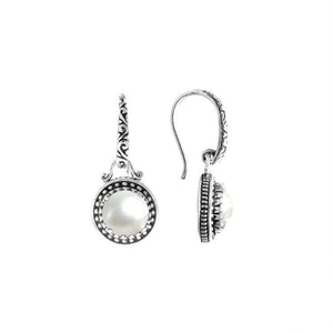 Wholesale sterling silver earrings with round Mabe Pearl and handcrafted metal detailing.