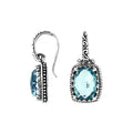 Wholesale sterling silver earrings with rectangular Blue Topaz Quartz and handcrafted metal details.