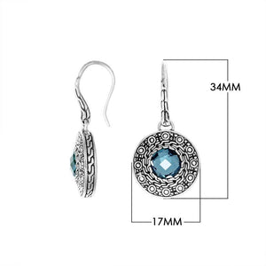 Wholesale sterling silver round earrings with Blue Topaz Quartz and patterned frame.