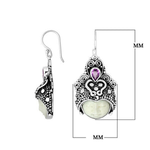 Wholesale sterling silver ornate headdress earrings with carved bone face and Amethyst Quartz accent.