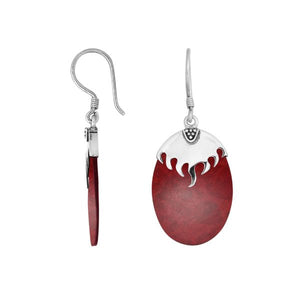 Wholesale sterling silver earrings featuring Red Coral ovals topped with a polished structured silver cap.