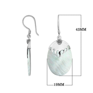 Wholesale sterling silver earrings with Mother Of Pearl ovals and a polished structured silver cap.