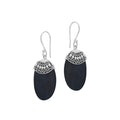 Wholesale sterling silver earrings featuring Black Shell ovals with an ornate patterned silver cap.