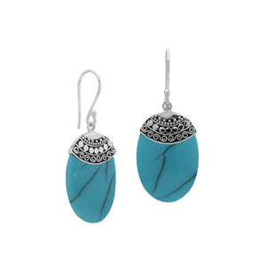 Wholesale sterling silver earrings with Turquoise Shell ovals and an ornate patterned silver cap.