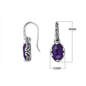 Wholesale sterling silver earrings with oval Amethyst Quartz set in ornate scroll-accent frames.