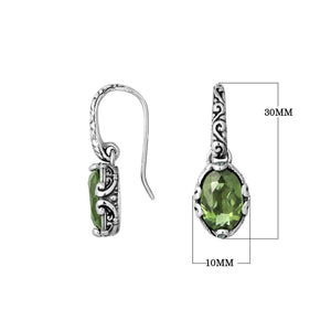 Wholesale sterling silver earrings with oval Green Amethyst Quartz and ornate scroll-accent frames.