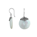 Wholesale sterling silver round earrings featuring luminous Mother Of Pearl and elegant scrollwork detailing.