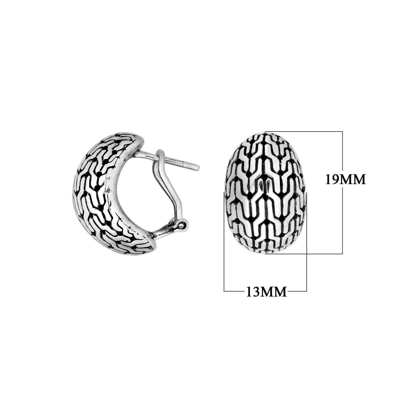 Wholesale sterling silver omega-back patterned hoop earrings with oxidized detailing.