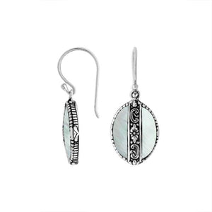 Sterling silver Mother Of Pearl oval earrings with floral silver center band for wholesale jewelry collection.