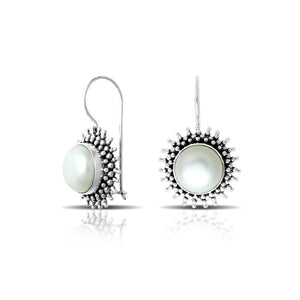Wholesale sterling silver Bali granulated earrings featuring luminous mabe pearl centers with polished–oxidized detailing, crafted to enhance luxury artisan-focused wholesale jewelry collections.