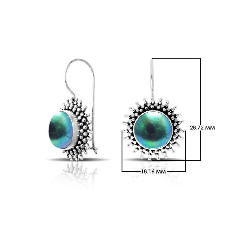 Green Mabe Pearl sterling silver artisan earrings featuring a sunburst textured frame with polished earwire hooks, designed as handcrafted statement dangle jewelry.
