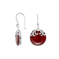 Wholesale sterling silver earrings featuring round red coral drops with polished wave-motif top.
