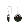 Sterling silver earrings featuring round Black Shell drops accented with polished filigree details and classic earwire hooks, handcrafted with precision in Bali.