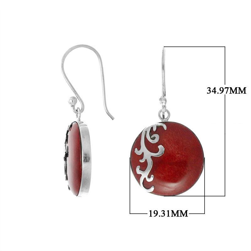 Wholesale sterling silver earrings featuring round red coral drops with a polished wave-motif overlay, crafted to provide consistent artisan quality and elegant catalog-ready presentation for bulk jewelry buyers.